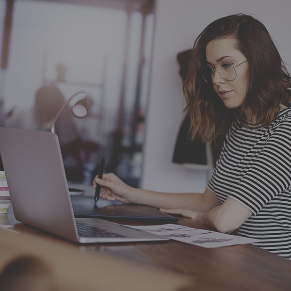 Woman viewing CRM while working