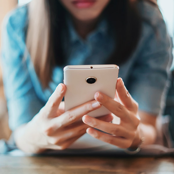 woman reading email on phone