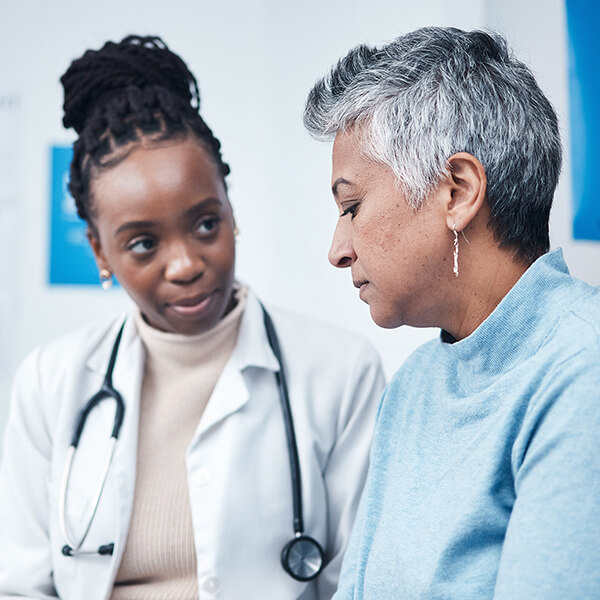 doctor talks with a patient