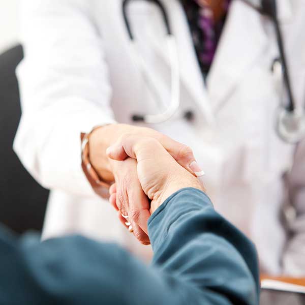 healthcare marketer shaking hands with physician