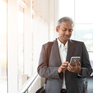 Salesperson checking email alerts