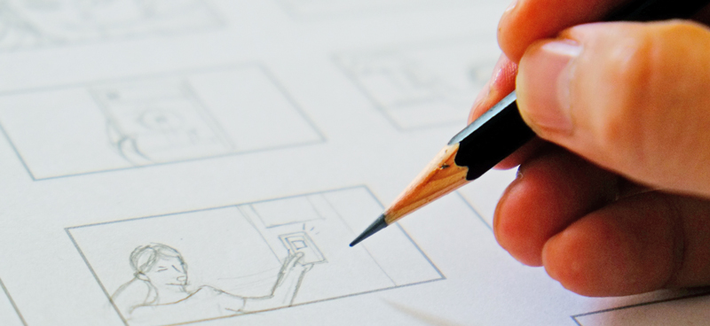 Photo showing someone drawing to storyboard a digital marketing video