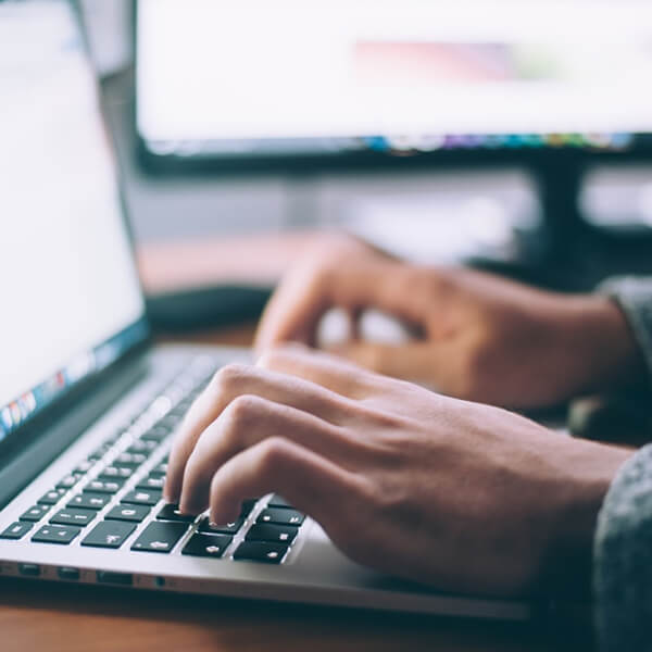 Man uses a content style guide to write website copy, photo by Glenn Carstens-Peters on Unsplash