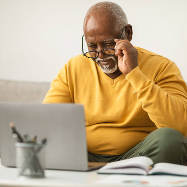 man struggles to read copy on a site that didn’t go through website accessibility testing